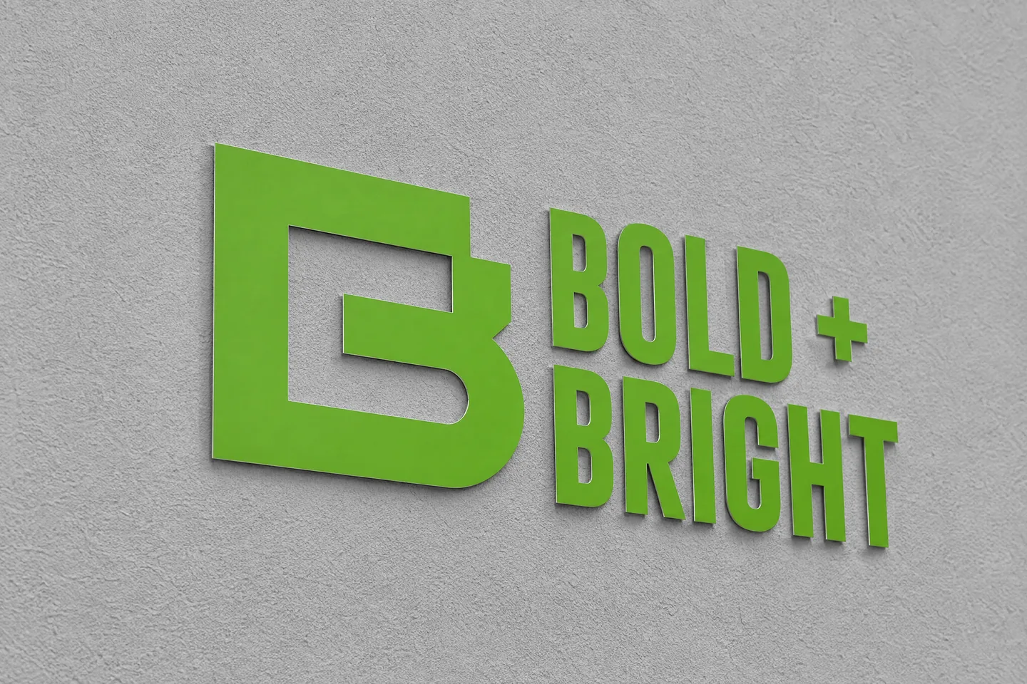 Bold+Bright-Logo als gefräste Buchstaben aus Aluverbund, wenige Millimeter vor einer hellen Putzwand montiert